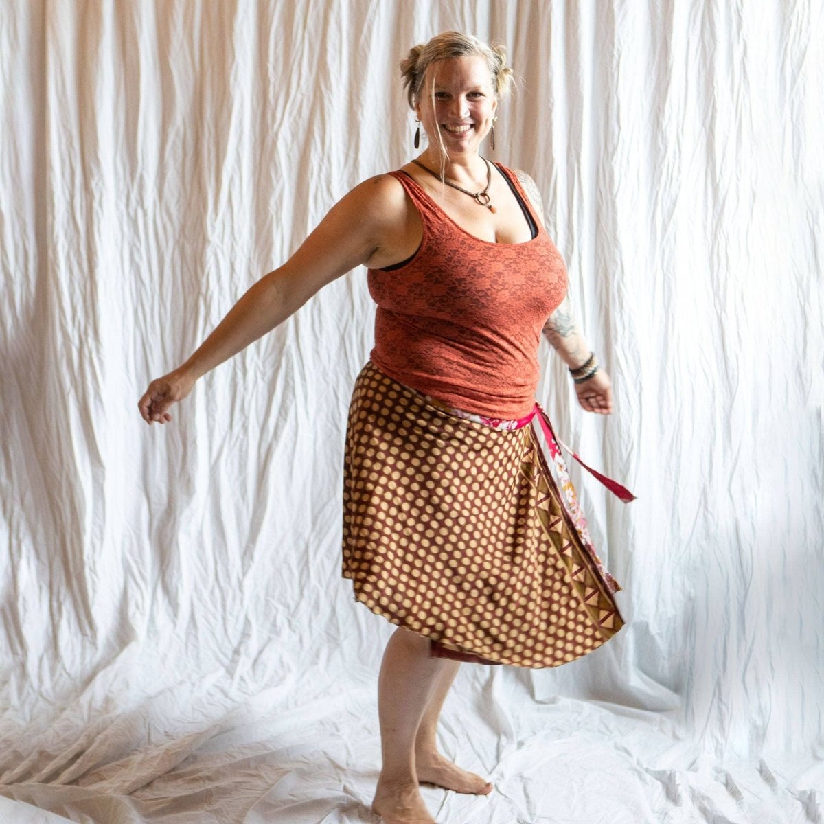 Darn Good Yarn The Original Sari Wrap Skirt in vibrant fabric, styled as a bohemian clothing accessory with intricate patterns.
