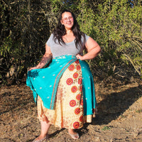 Colorful sari wrap skirt by Darn Good Yarn, featuring vibrant fabric and a flowing, versatile design perfect for boho fashion.