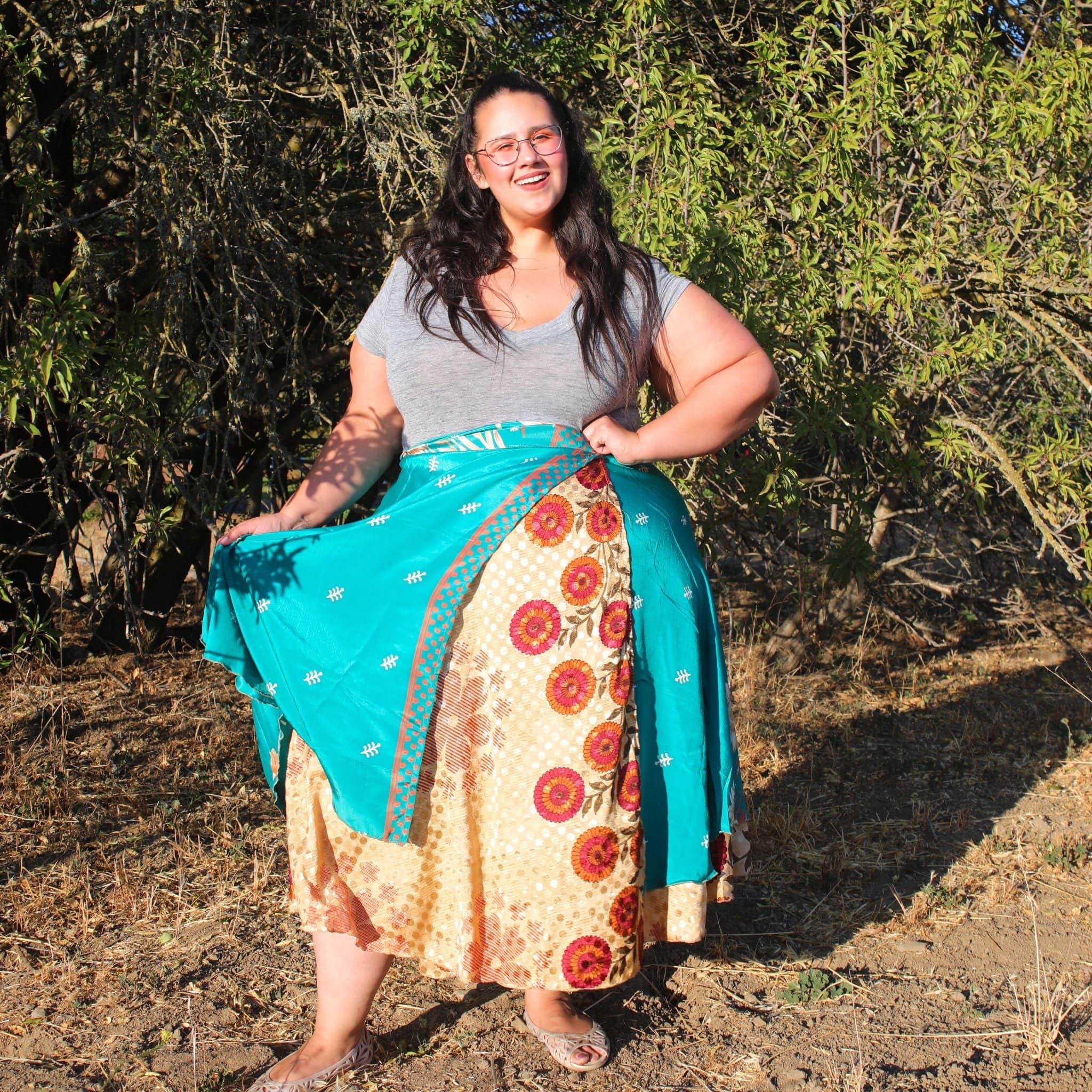 Colorful sari wrap skirt by Darn Good Yarn, featuring vibrant fabric and a flowing, versatile design perfect for boho fashion.