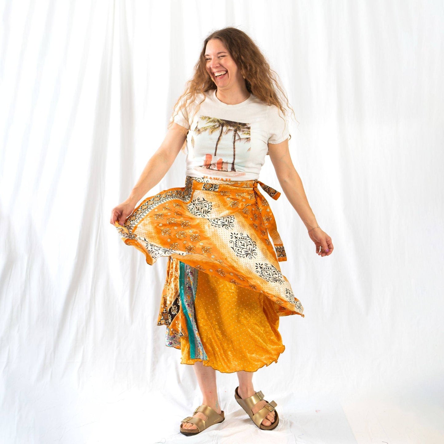 Colorful sari wrap skirt by Darn Good Yarn, featuring vibrant fabric and a flowing, stylish design for casual or boho wear.