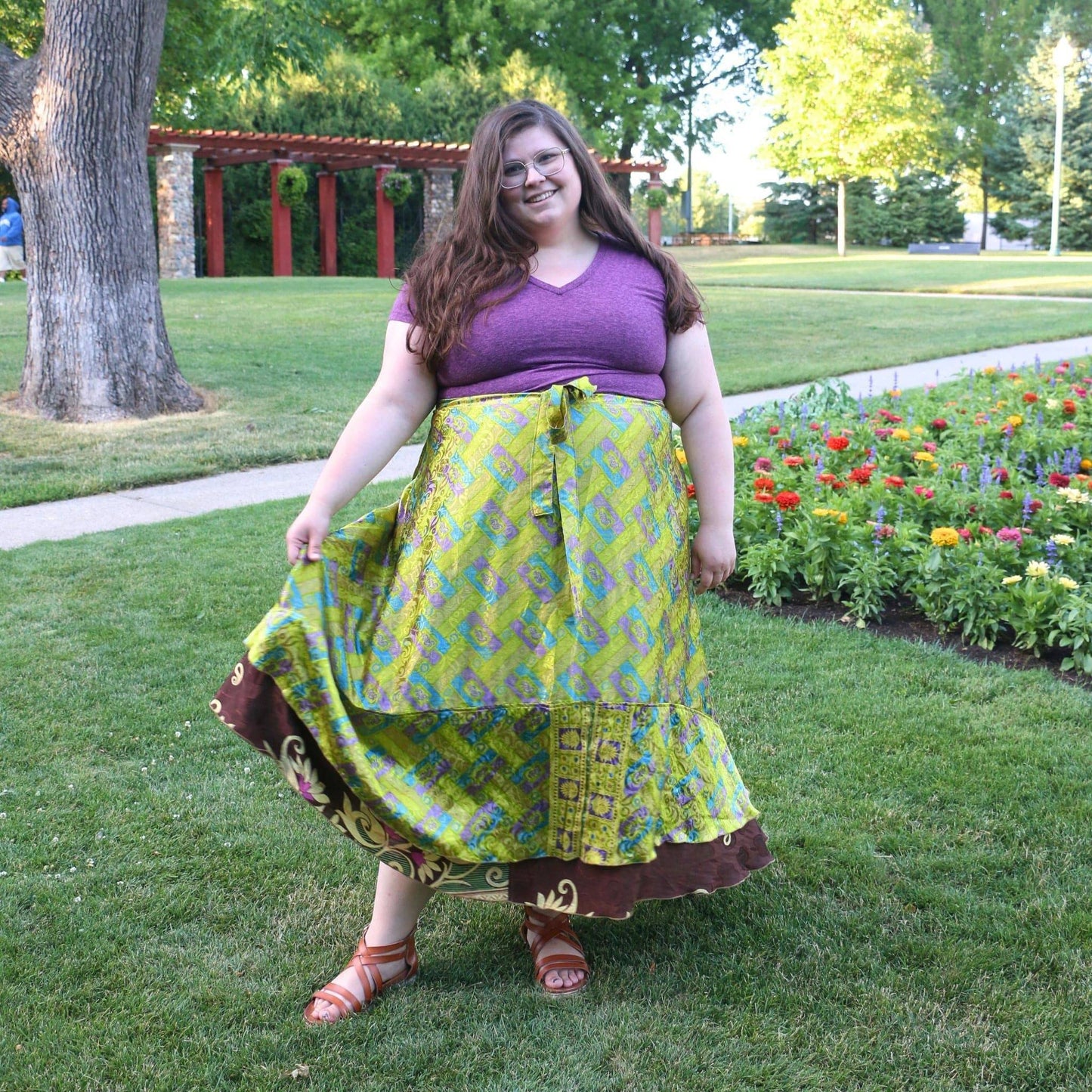 Colorful Darn Good Yarn The Original Sari Wrap Skirt made from vibrant sari fabric, styled for a boho-chic look.
