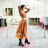 Colorful sari wrap skirt from Darn Good Yarn, featuring vibrant fabric and traditional wrap design for a stylish, bohemian look.
