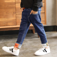 Children's boys' denim trousers by Ancient Energy, featuring classic blue denim fabric and a comfortable fit for kids.