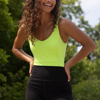 Elastique Athletics Riviera Bodysuit, fitted black bodysuit with scoop neckline and long sleeves for activewear and casual wear.