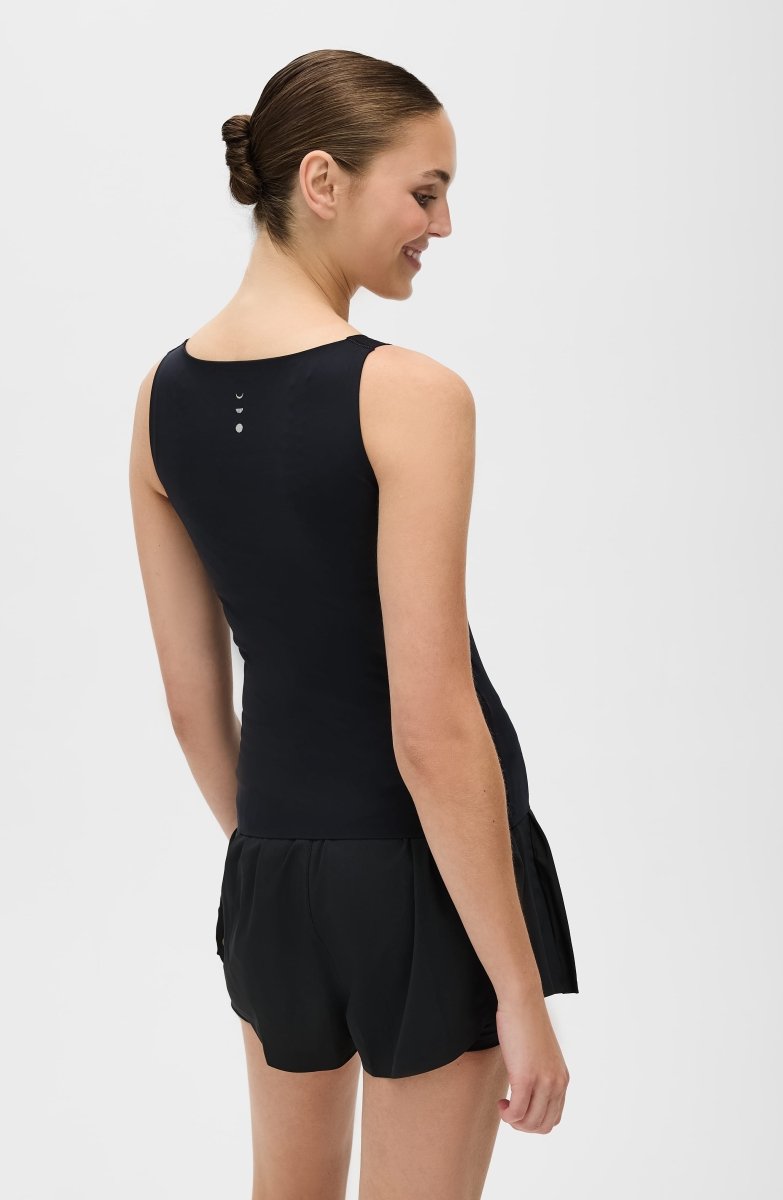 Elastique Athletics Iconic MicroPerle Tank top in a lightweight, breathable fabric, shown on a model.