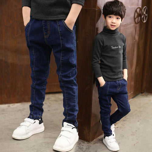 Boys' denim trousers from Ancient Energy, casual children's clothing with classic blue denim, front pockets, and belt loops.