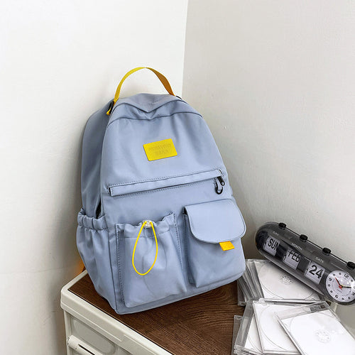Ancient Energy nylon school backpack for junior high students, featuring multiple compartments and adjustable straps.