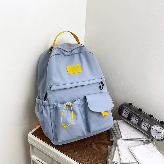 Ancient Energy nylon school backpack for junior high students, featuring multiple compartments and adjustable straps.