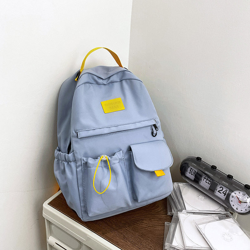 Ancient Energy nylon school backpack for junior high students, featuring multiple compartments and adjustable straps.