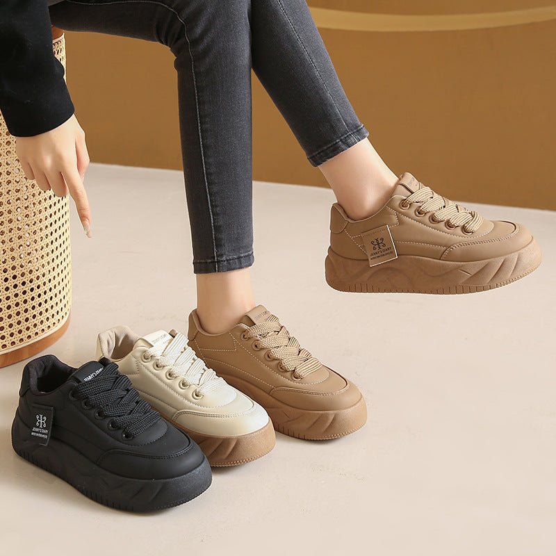 Color block FitiqueFit height increasing sneakers with lace-up design and low top style for fashionable footwear.