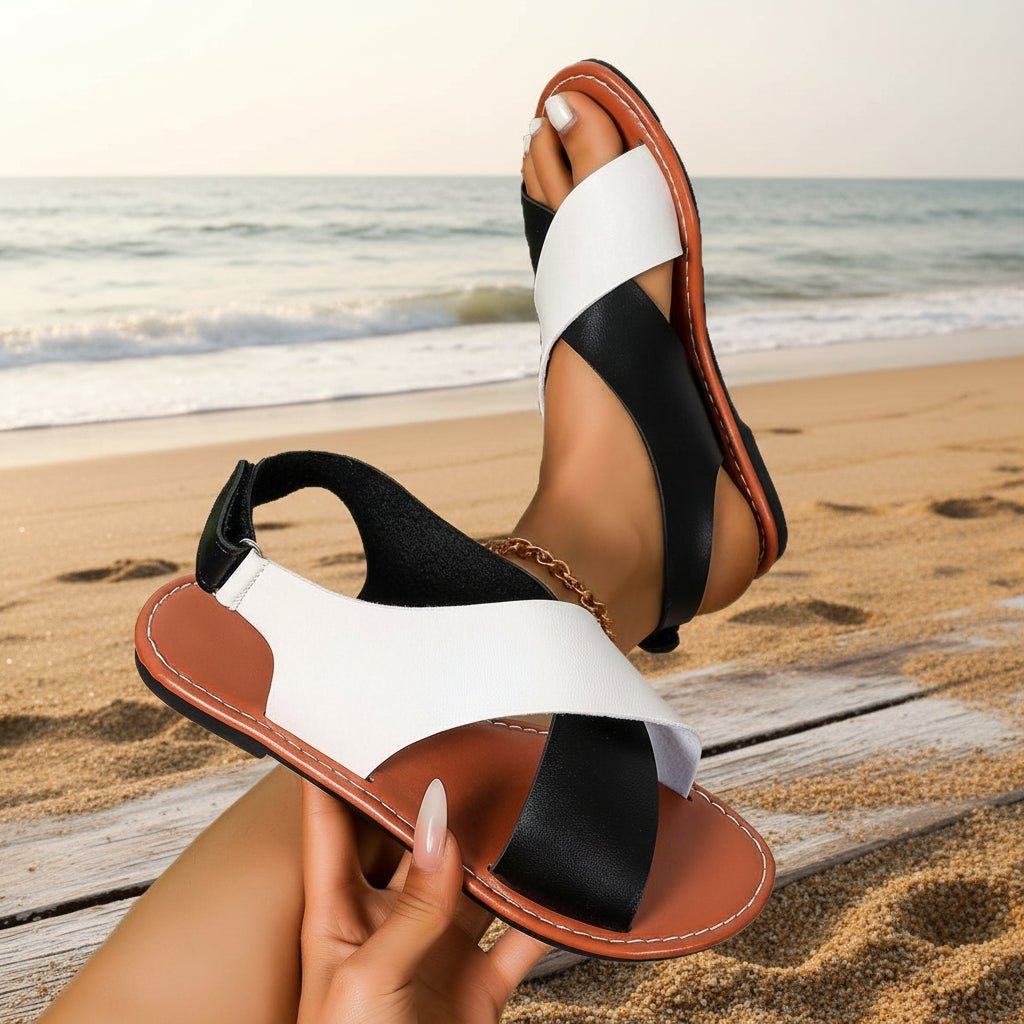 Women's color-block cross-strap flat sandals by FitiqueFit, featuring vibrant straps and comfortable flat sole.