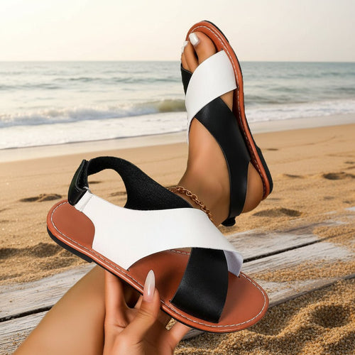 Women's color-block cross-strap flat sandals by FitiqueFit, featuring vibrant straps and comfortable flat sole.