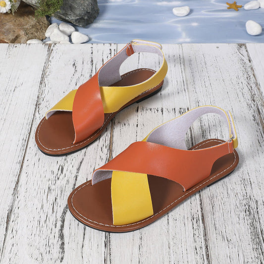 Women's color-block cross-strap flat sandals by FitiqueFit featuring vibrant straps and a comfortable flat sole.