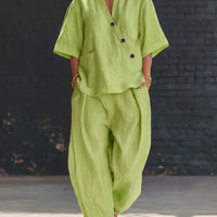 FitiqueFit two-piece set with a V-neck short sleeve top and high-waist trousers, displayed on a mannequin.