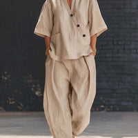 FitiqueFit V-neck short sleeve top and high-waist trousers two-piece set, shown on a model with neutral background