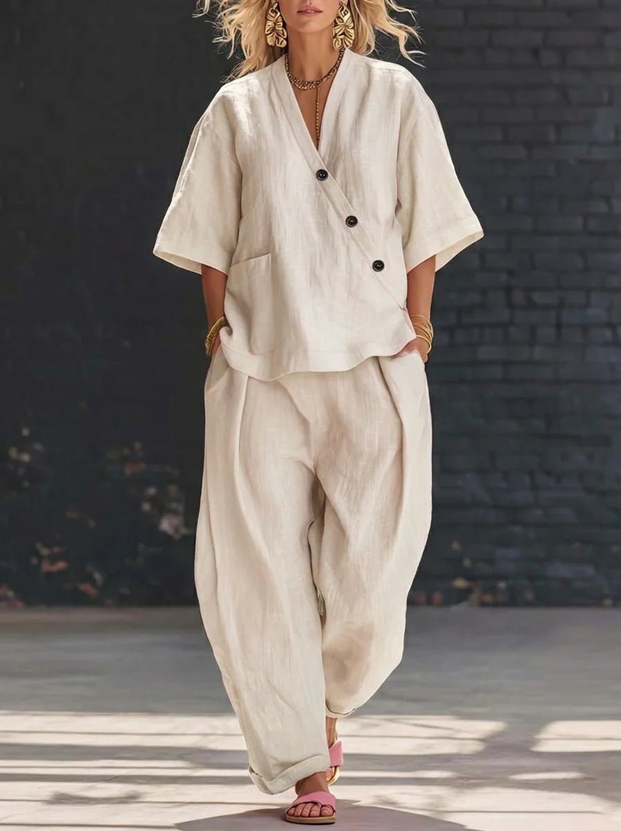 FitiqueFit two-piece set with a V-neck short sleeve top and high-waist trousers, displayed on a neutral background.