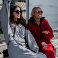 IWOM WeatherShield Convertible Jacket in black, showing its adjustable hood, multiple pockets, and versatile design for outdoor wear.