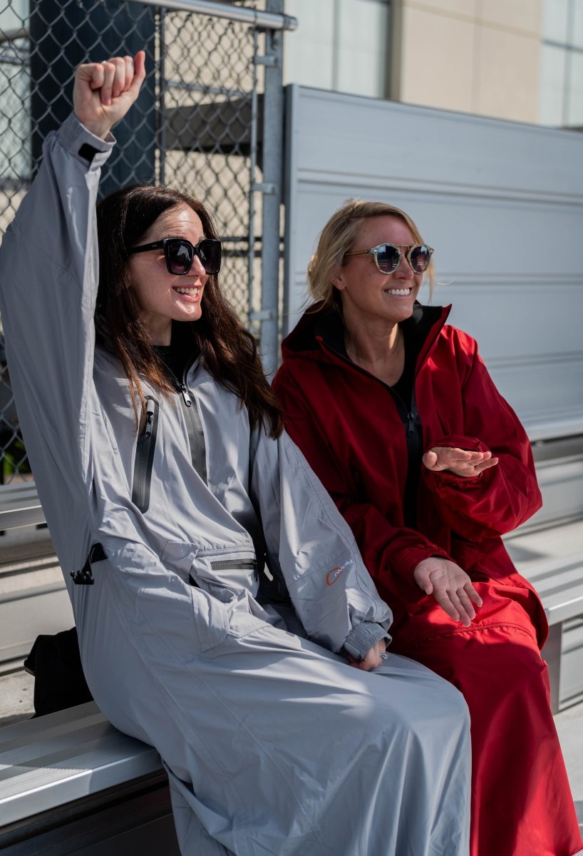 IWOM WeatherShield Convertible Jacket in black, showing its adjustable hood, multiple pockets, and versatile design for outdoor wear.