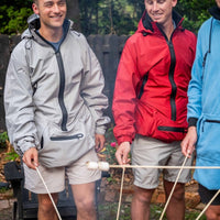 IWOM WeatherShield Convertible Jacket displayed on a model, showing adjustable features and water-resistant fabric in a casual outdoor setting.
