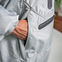 IWOM WeatherShield Convertible Jacket displayed on a hanger, showcasing its versatile design and durable outer fabric.
