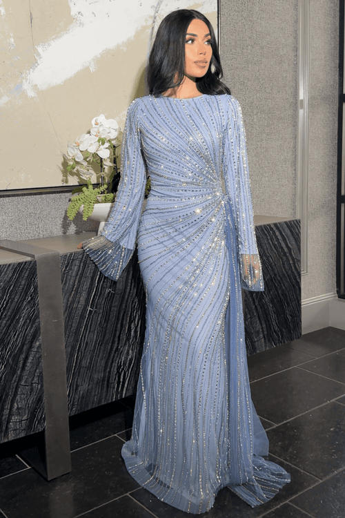 Iyza Belaar Abira sequin modest neckline long sleeve dress with embellished details and side skirt, elegant evening wear.