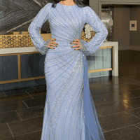 Iyza Belaar Abira sequin modest neckline long sleeve dress with embellished details and side skirt, perfect for elegant occasions.
