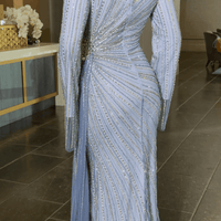 Iyza Belaar Abira sequin embellished modest long sleeve dress with neckline and side skirt for elegant occasions.