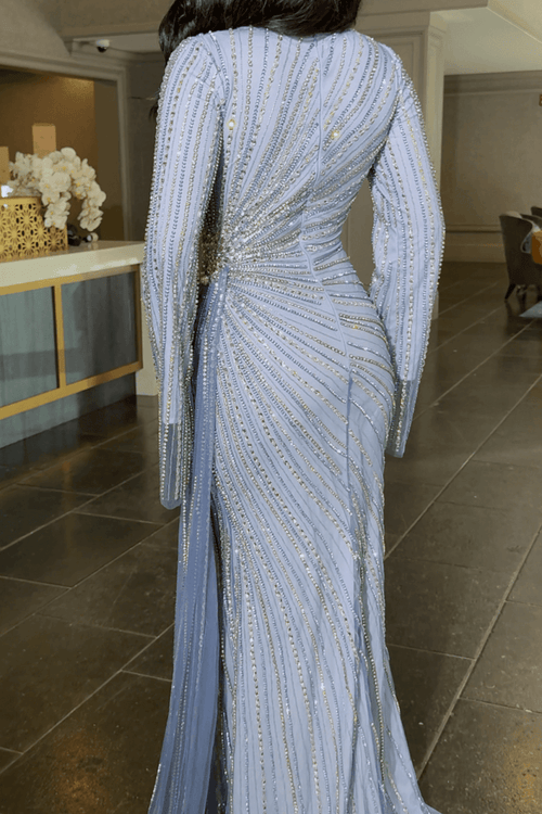 Iyza Belaar Abira sequin embellished modest long sleeve dress with neckline and side skirt for elegant occasions.