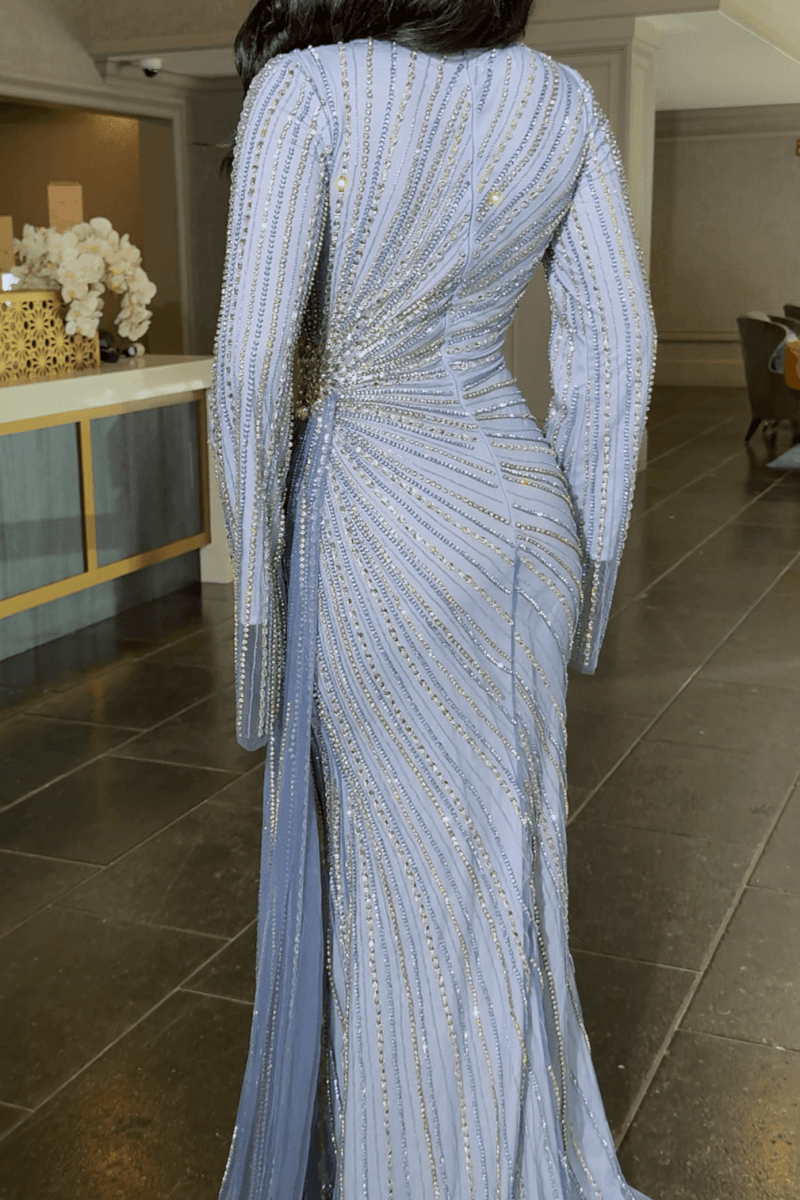 Iyza Belaar Abira sequin embellished modest long sleeve dress with neckline and side skirt for elegant occasions.