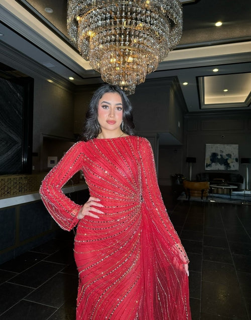 Iyza Belaar Abira sequin modest neckline long sleeve embellished dress with side skirt, elegant evening dress with intricate beadwork.