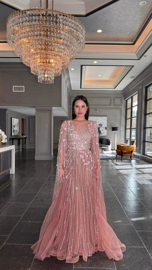 Elegant Inaya Long Drape Sleeves Beaded A-line gown by Iyza Belaar, featuring intricate beadwork and flowing fabric.