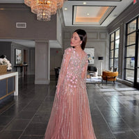 Iyza Belaar Inaya long drape sleeves beaded A-line gown, elegant dress with intricate beadwork and flowing silhouette.