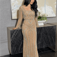 Iyza Belaar Reema sequin embellished long sleeve dress with square neckline, modest style, and intricate detailing.