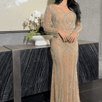 Iyza Belaar Reema Sequin modest long sleeve dress with square neckline and embellished design, perfect for elegant occasions.