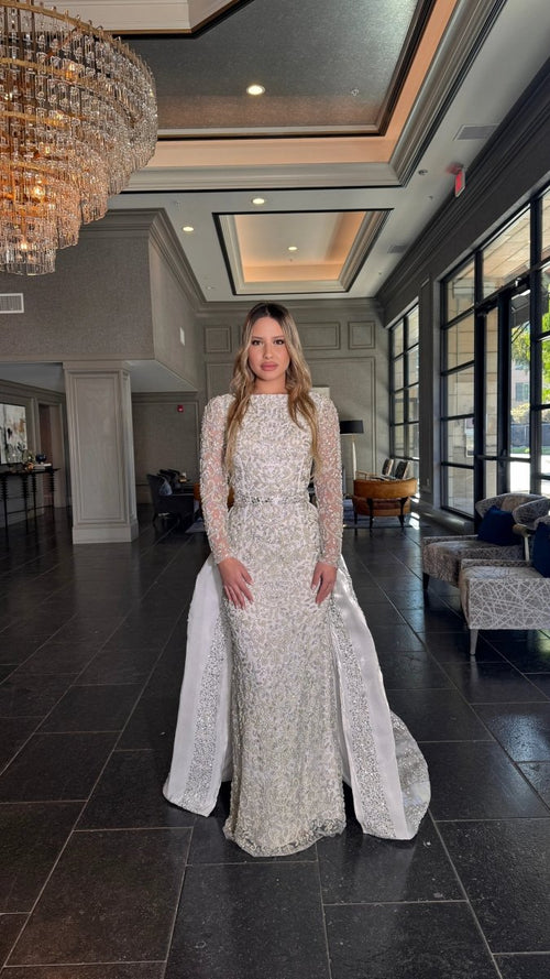 Iyza Belaar Aleena bridal long dress with pearl and crystal embellishments, beaded gown featuring a detachable overskirt.
