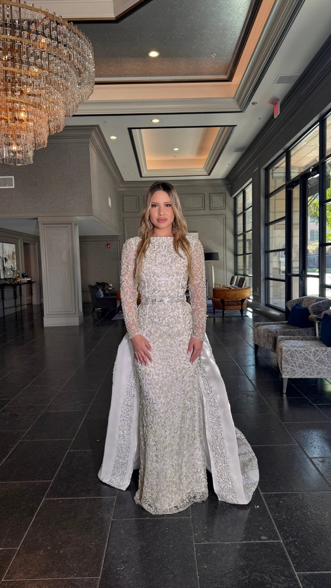 Iyza Belaar Aleena bridal long dress with pearl and crystal embellishments, beaded gown featuring a detachable overskirt.