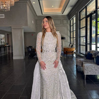 Iyza Belaar Aleena bridal long gown with pearl and crystal embellishments, beaded design, and a detachable overskirt.