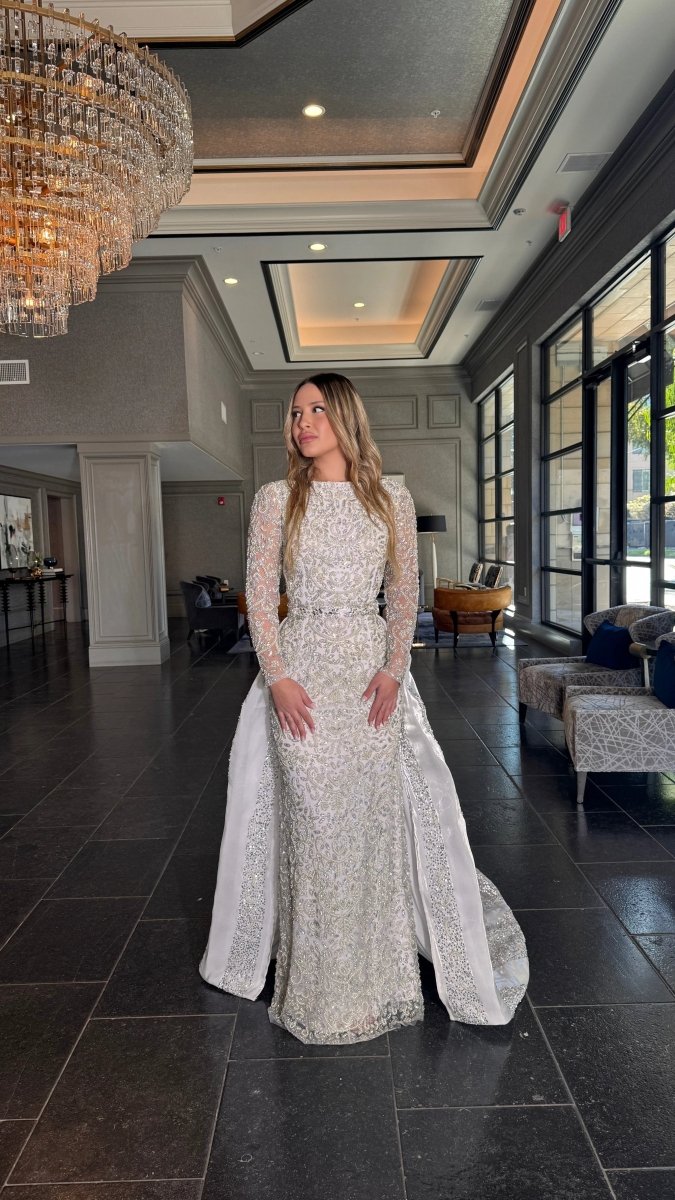 Iyza Belaar Aleena bridal long gown with pearl and crystal embellishments, beaded design, and a detachable overskirt.
