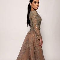 Iyza Belaar Aleya beaded removable embellished sequin overskirt over a long dress, detailed beading and embroidery visible.