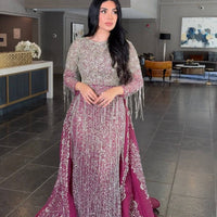 Iyza Belaar Aleya beaded detachable embellished sequin overskirt over a long dress, detailed beading and shimmering sequins visible.
