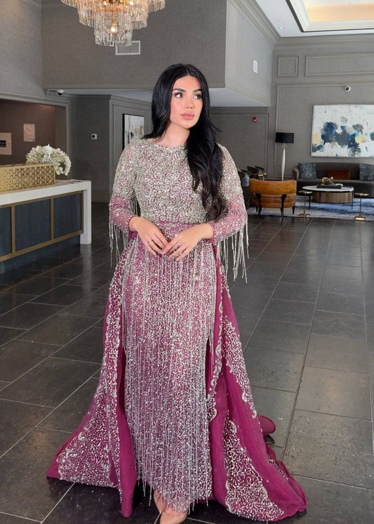 Iyza Belaar Aleya beaded detachable embellished sequin overskirt over a long dress, detailed beading and shimmering sequins visible.