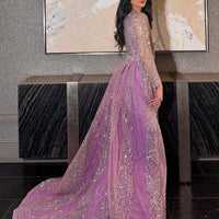 Iyza Belaar Aleya beaded detachable embellished sequin overskirt over a long dress, showcasing intricate beadwork and shimmering sequins.