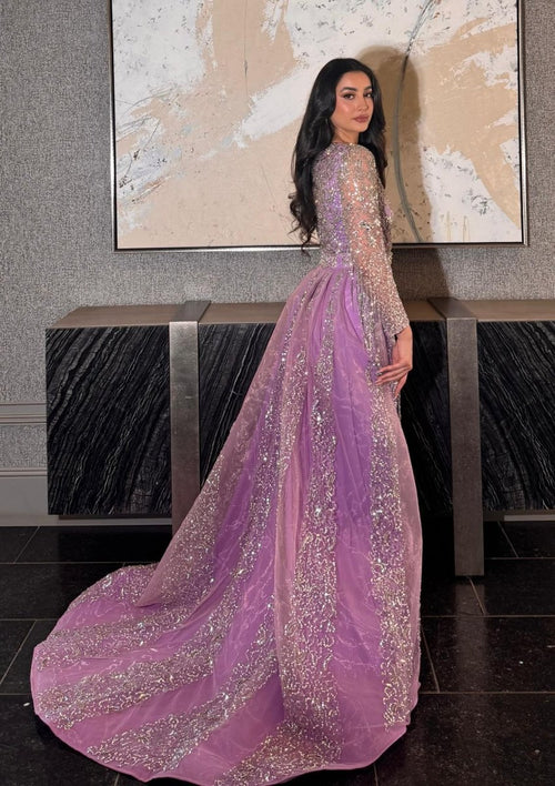 Iyza Belaar Aleya beaded detachable embellished sequin overskirt over a long dress, showcasing intricate beadwork and shimmering sequins.
