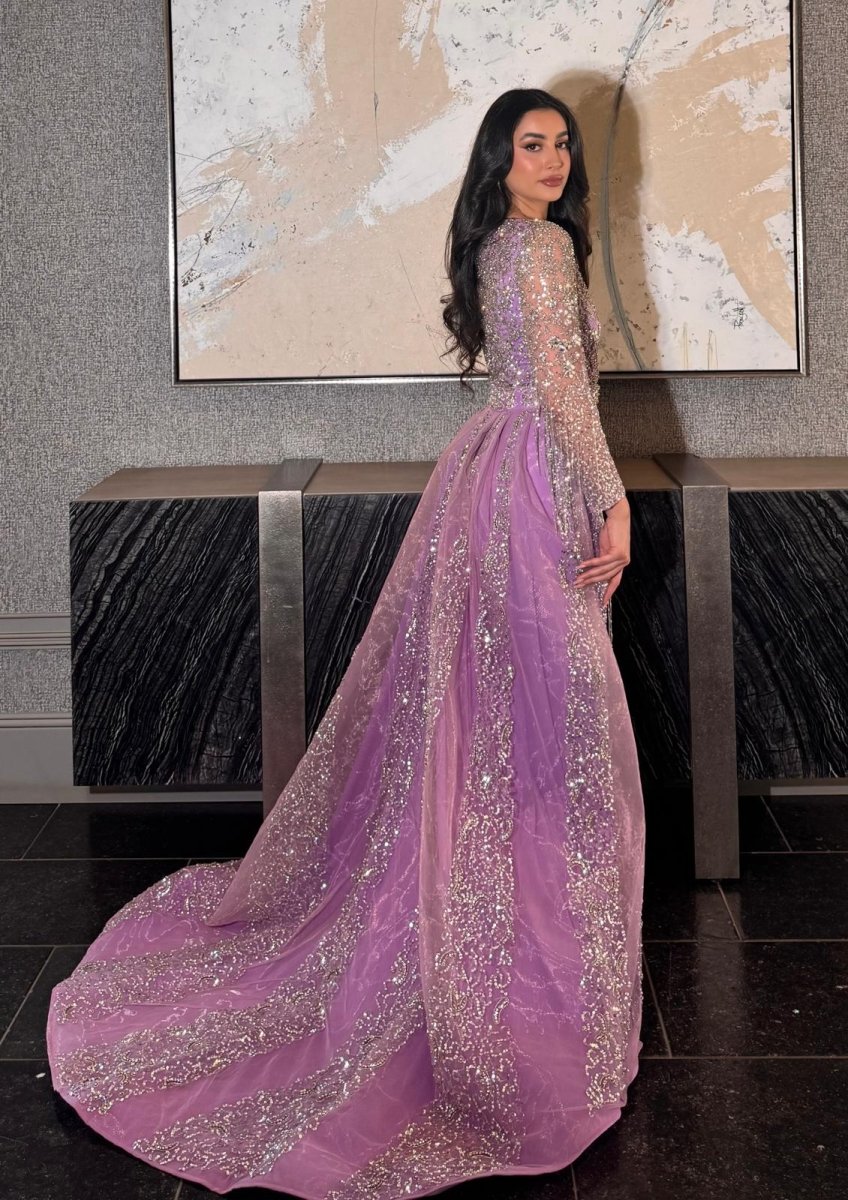 Iyza Belaar Aleya beaded detachable embellished sequin overskirt over a long dress, showcasing intricate beadwork and shimmering sequins.