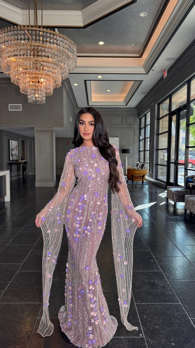 Iyza Belaar Basima long sleeve evening dress with floral sequins and embellishments, featuring a modest and elegant design.