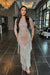 Iyza Belaar Dalia long sleeve beaded sequin modest tassel gown, elegant evening dress with intricate beadwork and flowing fabric.