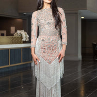 Iyza Belaar Dalia long sleeve beaded sequin modest tassel gown, elegant long dress with intricate beadwork and flowing silhouette.