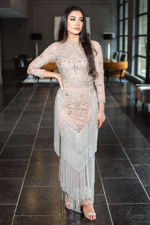 Long Dalia beaded sequin tassel gown by Iyza Belaar featuring long sleeves and a modest design, with intricate beaded detailing.