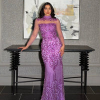 Iyza Belaar Deema long dress with high neckline, tulle fabric, and embroidered details, elegant evening wear for special occasions.