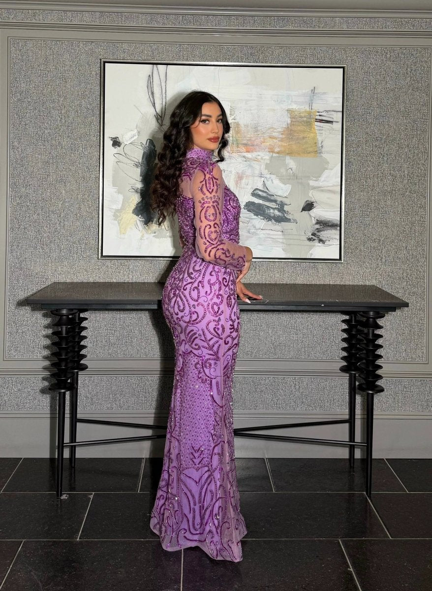 Iyza Belaar Deema long dress with high neckline and tulle fabric featuring intricate embroidery, elegant evening wear.